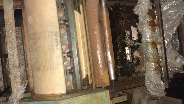 Both rollers had melted over the bed and the metal had rusted badly.